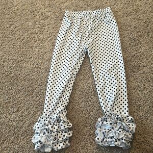 Black dots with white ruffle pants